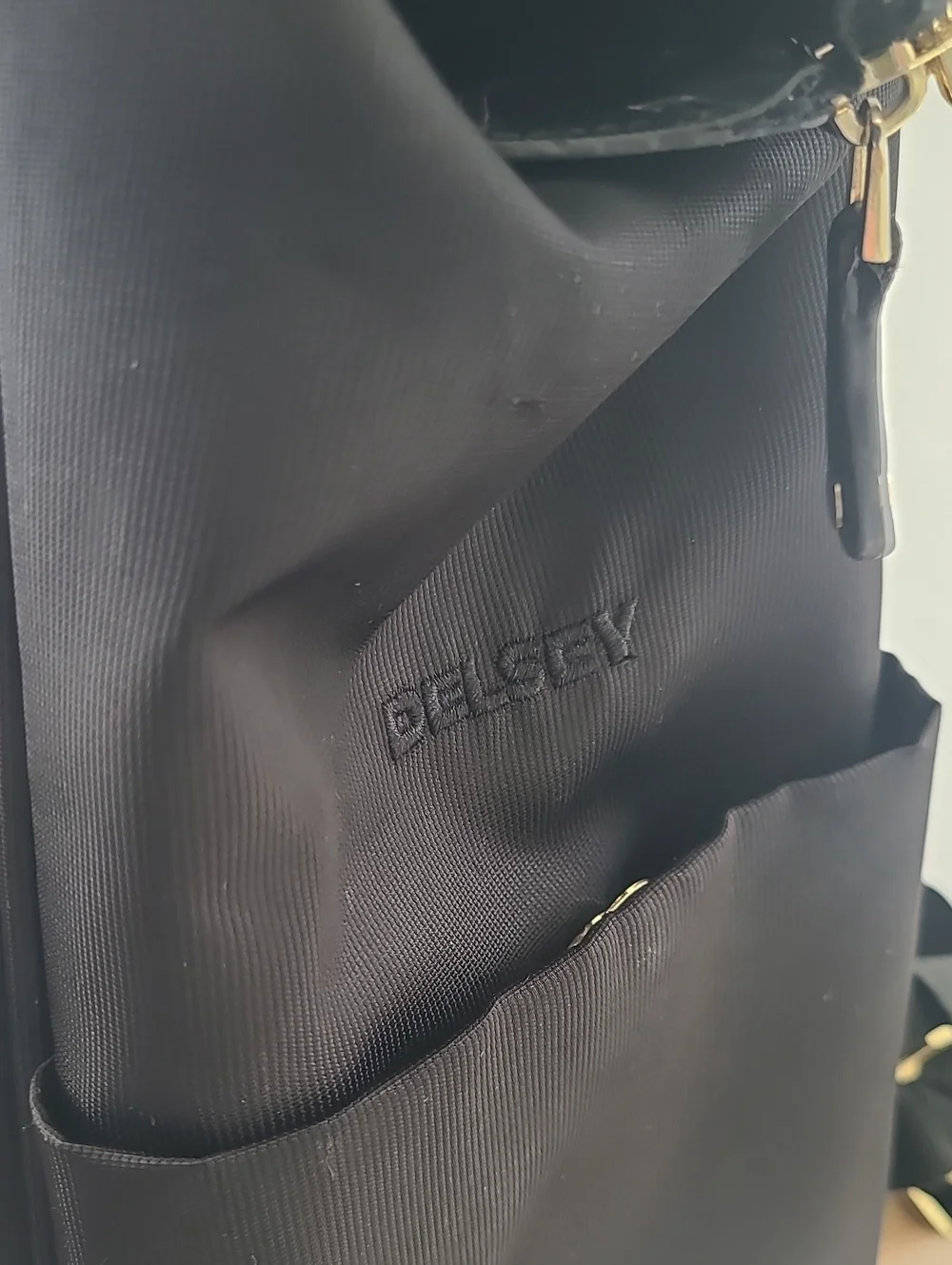 Delsey Paris Black Laptop Backpack with Gold Accent